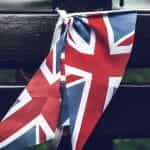 Union Jack flags on a bench.