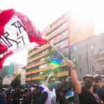 Peruvians wave their flag during a protest.